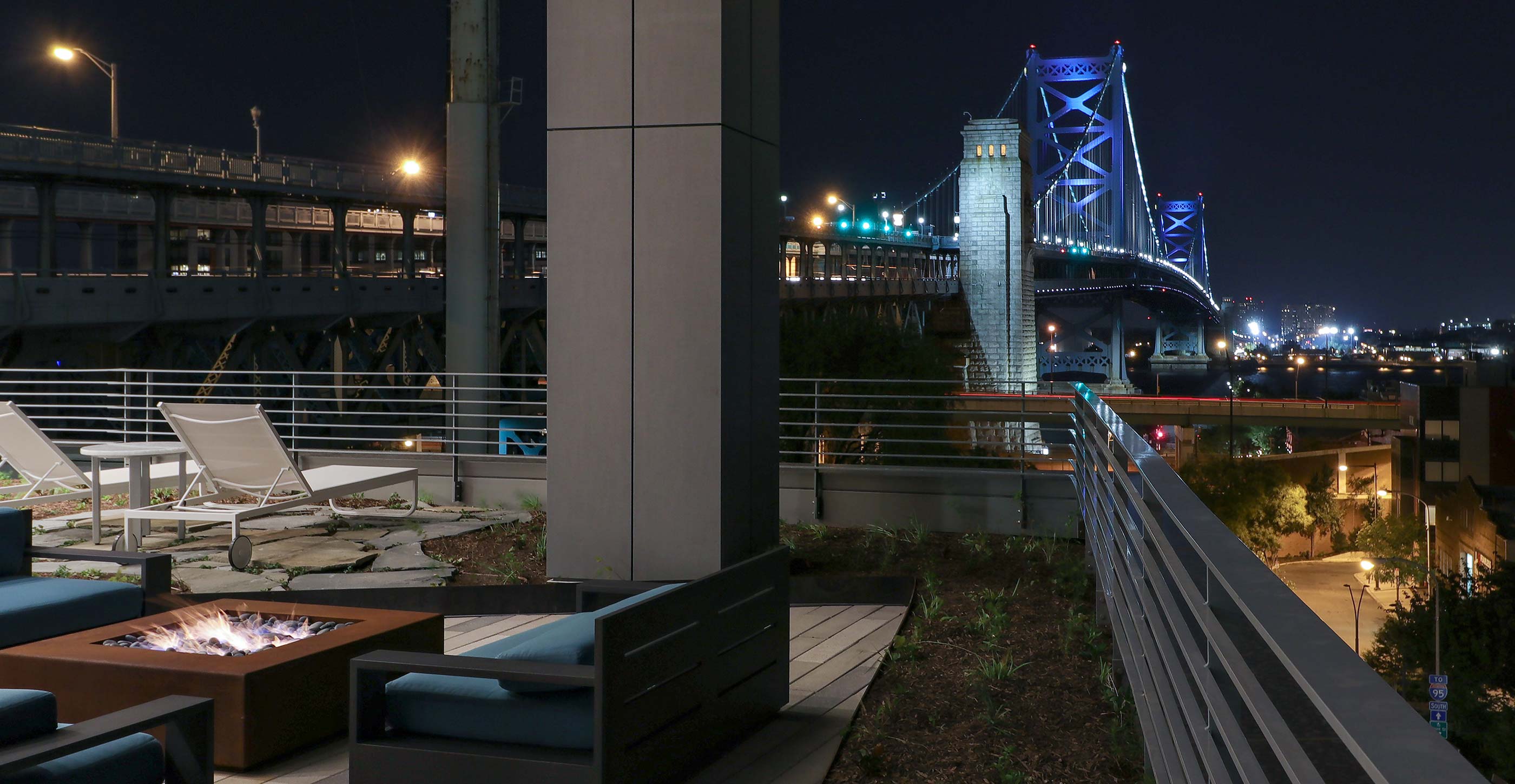 Nightime Bridge on Race patio view with Benjamin Franklin Bridge in background
